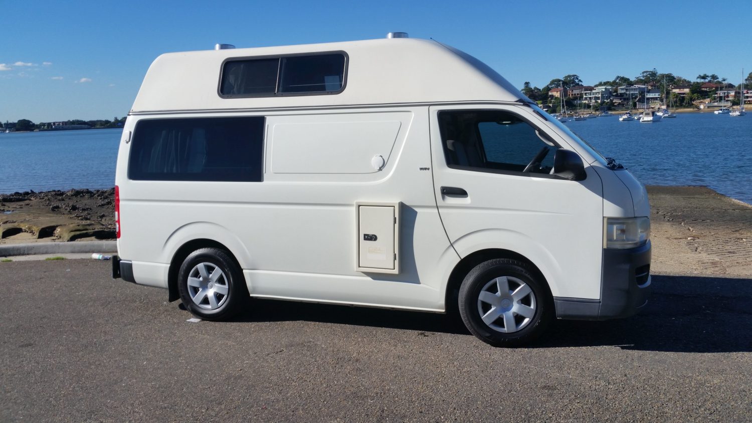 Hightop Campervan Parked Overlooking The Sea - Campervan Rentals Australia - Campervan Rental Shop